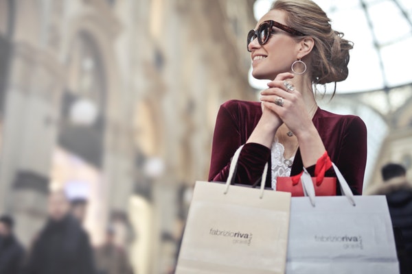 sophisticated woman happy with her purchases leave positive review