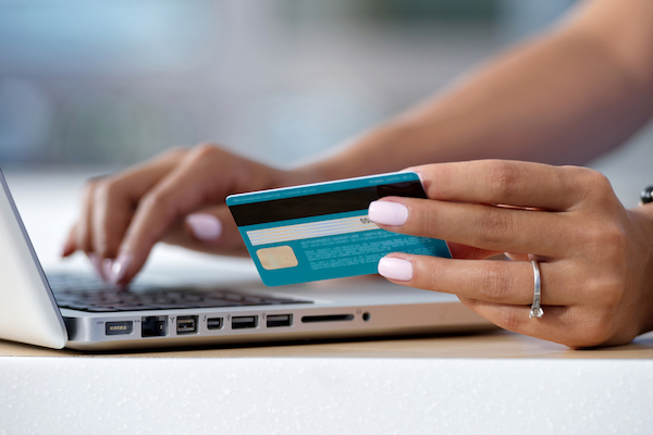 woman using credit card on laptop for small business ecommerce
