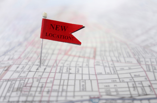 map with red new location pin for franchising your business
