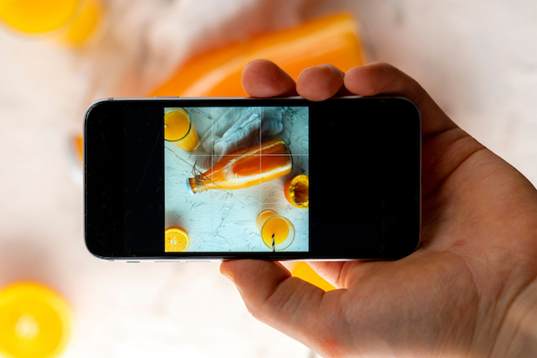 smartphone image of orange juice for instagram marketing