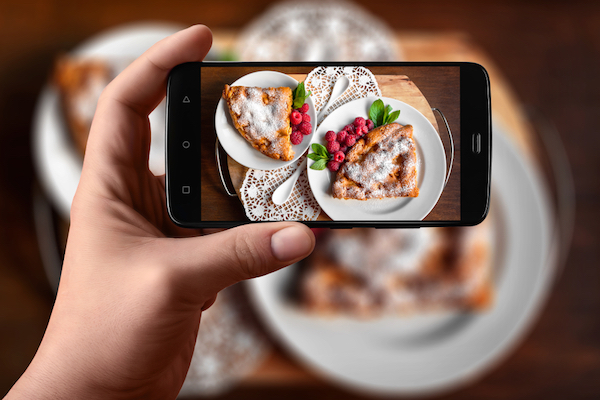 image of cell phone taking picture of pastry for small business marketing