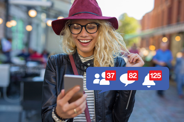 blonde woman happy with feedback on Facebook