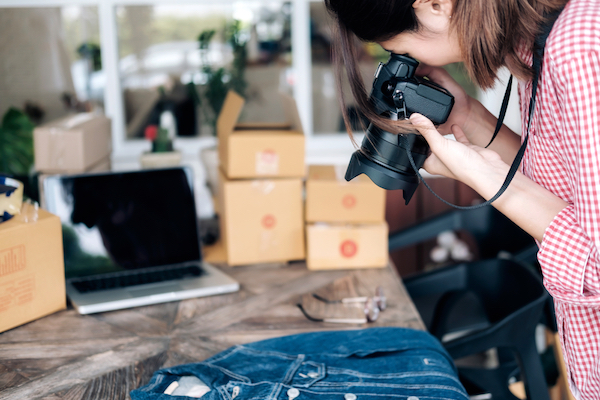 female photographer taking images of product for small business
